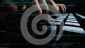Close-up of Hands Typing on Keyboard with Code and Programming Syntax in Dark Environment for Technology and Software