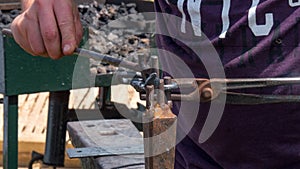 Detailed shot of metal being worked at a blacksmith forge