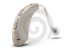 Modern beige behind-the-ear hearing aid with clear eartube and receiver isolated on white background