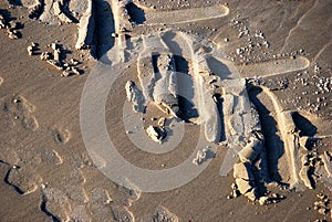 Detailed tire tracks on a beach