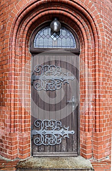 Detailed view on an aged and weathered medieval church building