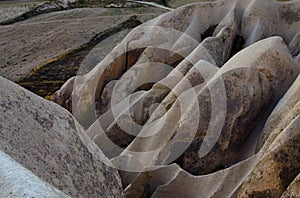 Detailed view of amazing shaped sandstone rocks. Typical geologic formations of Cappadocia. Abstract nature landscape