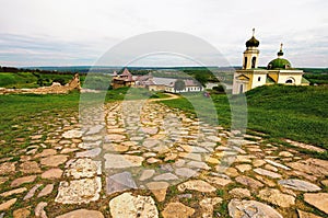 Detailed view of the ancient cobblestone way to the medieval Khotyn fortress. Wide-angle spring landscape view