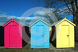 Detailed view of brightly painted beach huts at the small seaside village of Abersoch, Wales