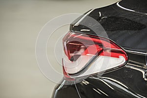 Detailed view of a car light damaged by hail showing the forces of nature and the importance of car insurance