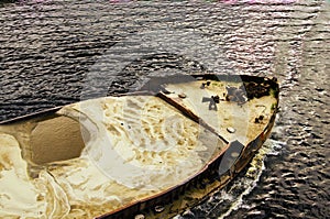 Detailed view of cargo ship barge loaded with sand. Top view of the front of the barge