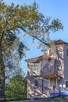 Detailed view of classic building located in the tourist complex of the Bussaco forest photo