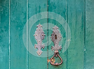 Detailed view of a classic door lock on old wooden door