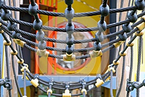 Detailed view of a colorful rope bridge on a children\'s playground