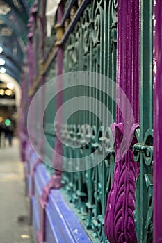 Detailed view of colourful wrought ironwork at Smithfield meat and poultry market in the City of London, UK.