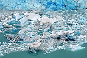 Detailed view of falling ice structures from Perito Moreno Glacier, in El Calafate, Argentina, against blue frozen