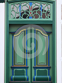 Detailed view of a green door from a rural house in the old country , called Altes Land, near Hamburg, the door is only used for