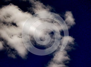 Detailed view of a large fleecy cloud, altocumulus, at an altitude of about 3000 to 6000 meters. It is a sign of unstable to come