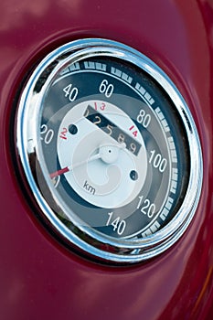 Detailed view of an old motorbike tachometer.