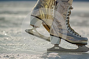 A detailed view of a pair of ice skates, showcasing their design, blades, and strap