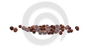 Detailed view of a pile of allspice. Spices isolated on white background