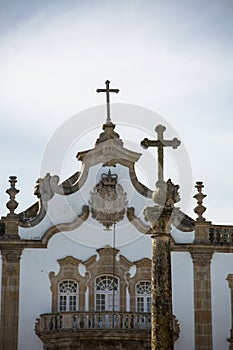 Detailed view at the pillory with a cross and the pediment cornice at the Church of Mercy, baroque style monument, architectural