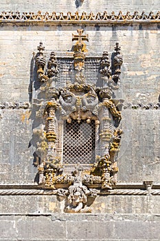 Detailed view at the portuguese gothic ornamented window, manueline facade, with ornamented details, iconic chapterhouse window,