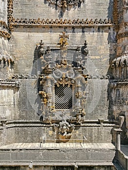 Detailed view at the portuguese gothic ornamented window, manueline facade, with ornamented details, iconic chapterhouse window,