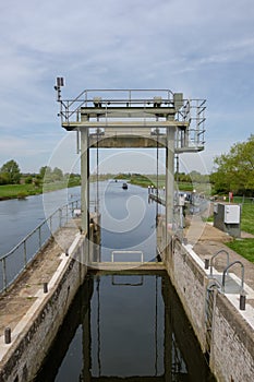 Detailed view of a river lock system used by canal and narrowboats.