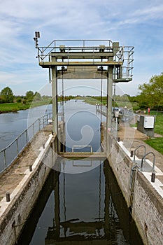 Detailed view of a river lock system used by canal and narrowboats.