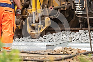 Detailed view of a tamping machine at work