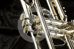 Detailed view of trumpet with three finger button and valves