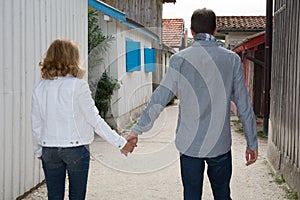 Detailed view of a young couple holding hands