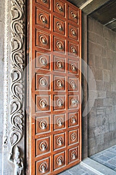 Detailed wooden door with bells - Kovil on kayts Island - Jaffna - Sri Lanka