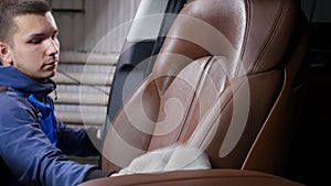 Detailing and cleaning of interior front seats at luxury modern cars. Car care concept