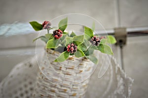 Details of artificial flower in bamboo basket