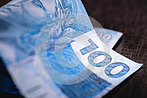 Details of the banknote of 100 reais from brazil photo