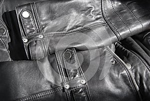 The details of a black leather jacket