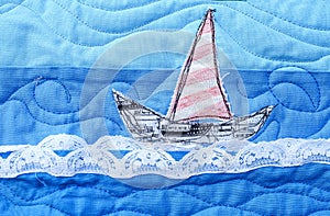 Details of a boat on a  coastal and nautical baby quilt