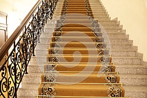 Details of brown carpeted staircase