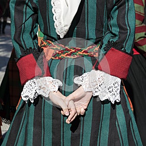 Details of Bulgarian traditional folk costume on young girl dancer from Trakia ensemble