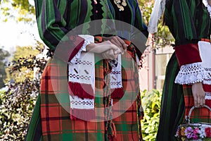 Details of a Bulgarian traditional folkore costume on young women dancers. Shot in Plovdiv Bulgaria