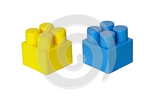 details of a children& x27;s plastic constructor on a white background. colored cubes. building