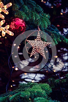 Details of Christmas ornaments and baubles in pine tree branches