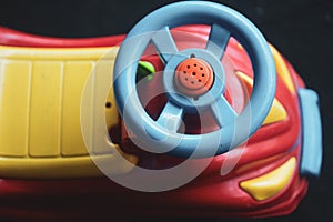 Details of a colorful plastic children toy bike/car