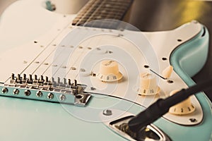 Details and connection of guitar and wire cable jack. Tone and volume controls