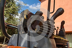 Details of crawler excavator such as the controls the cloches the bucket the hydraulic pumps the tracks photo