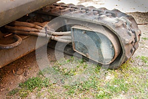 Details of crawler excavator such as the controls the cloches the bucket the hydraulic pumps the tracks photo