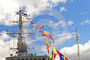 Details deck of the ship. The mast of the ship and signal flags.