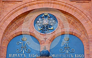 Details of the decoration of the brick wall coat of arms of Russia-the Imperial symbol of the double-headed eagle