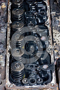 Details of a dirty diesel engine under the hood of car