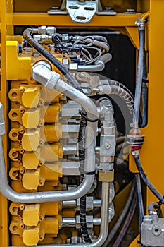 Details of the engine of a yellow heavy duty construction vehicle