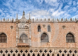 Details of facade of Doge's palace or Palazzo Ducale, Venice, Italy. Balcony with figures of Doge and Lion of St Mark