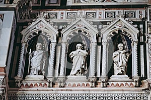 Sculptures of saints of Giotto bell tower facade in Florence, Italy