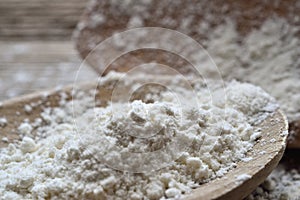 Details of flour on a wood spoon